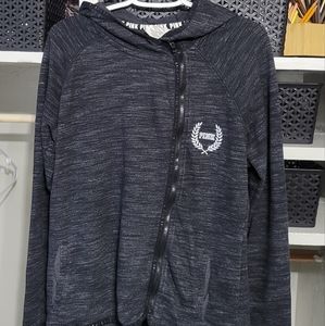 Charcoal gray/black VS PINK zip up. Zipper is slightly off center. Hi-low hem.